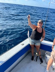 Two people enjoy a fishing tour in West Palm Beach