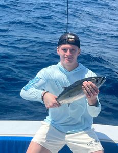Angler reeling in a 13-inch fish in West Palm Beach