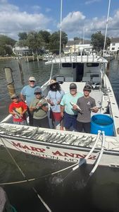 Fishing charter boat with successful catch displayed on deck at Oxford MD marina