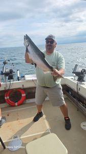 Angler with a pink salmon fish caught in NY