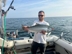 Angler reeling in an Atlantic Salmon in NY