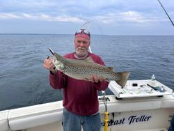 Reeling in joy on Ontario's waves.