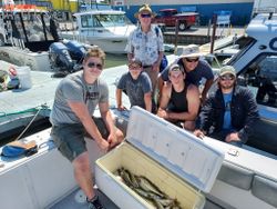 Six people fishing at the lakeside in Marblehead