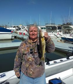 Angler fishing at lakeside in Marblehead