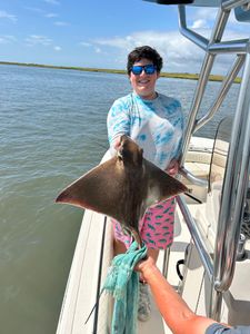 An angler reels in a 22-inch fish in New Jersey