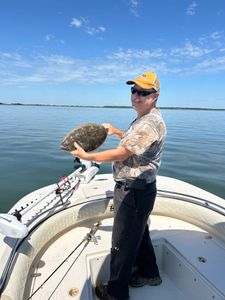 Angler holds a summer flounder in NJ