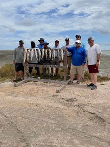 A group of 9 people enjoying a fishing trip at South Padre Island