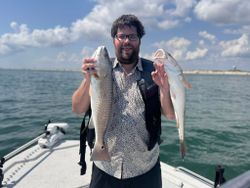 Two redfish caught on fishing charter in Rockport TX