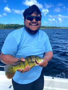 Angler with one small fish caught in PR
