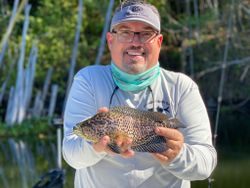 A fisherman catches a 10-inch fish in PR