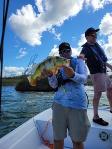Two anglers with a caught fish in Dorado