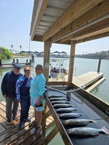 Anglers with 2 big fish caught while fishing in Port Mansfield