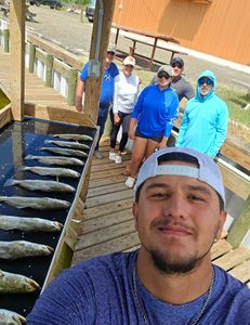 5 people fishing in Port Mansfield