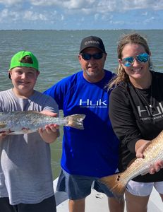 Two people fishing in Galveston