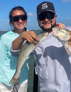 Two people fishing on the coast in Galveston