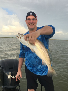 Fisherman with a single 18-inch catch in Galveston