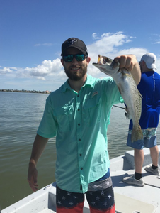 Angler catching a fish in Galveston