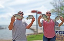 Three fishing rods with a stunning backdrop of the Texas landscape