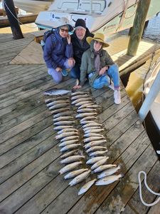 Three people fishing in New Orleans
