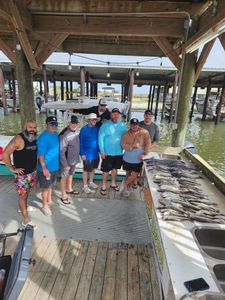 A group of 8 people fishing in New Orleans
