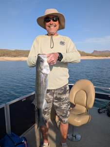 Caught the big one on a perfect day out on the lake.