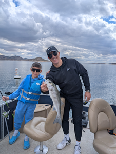 A day on the lake, casting lines and catching [fish caught].