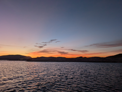 Peaceful sunset on the coast, a perfect day to be out on the water.