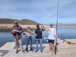 Spending a peaceful day by the lake with friends and the catch of the day.