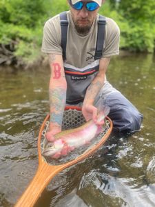 One fisherman catching a fish in VT