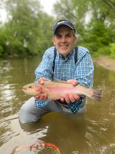 Photograph of a rainbow trout caught by a fisherman in Arlington
