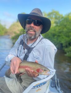 Photograph of a 11-inch rainbow trout caught while fishing in Arlington