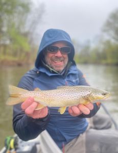 Angler holds a large sea trout fish caught in Arlington