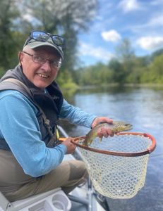 Serene fishing scene in Vermont with a sea trout