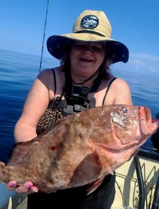 1 fisherman holding a 21-inch fish in NC