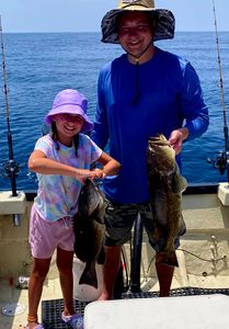 Two anglers holding large fish in North Carolina