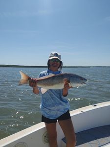 Angler reeling in a 21-inch fish in SC