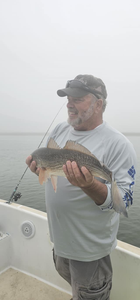 A person fishing at Folly Beach