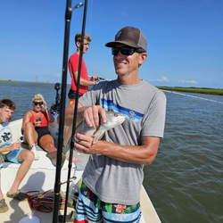 4 anglers fishing at Folly Beach