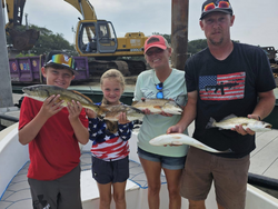3 redfish caught at Folly Beach while fishing