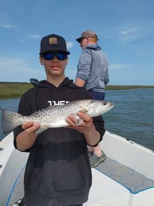 One spotted weakfish, a 21-inch catch, on fishing line at Folly Beach