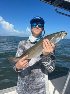 Angler with rod and reel fishing in Spanish Fort