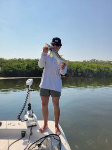 Fisherman reeling in a catch in FL