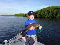 Angler holding a 17-inch fish in FL