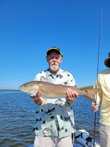 Angler poses with a large redfish caught in Homosassa