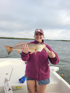 Big redfish hooked on a perfect partly cloudy day!