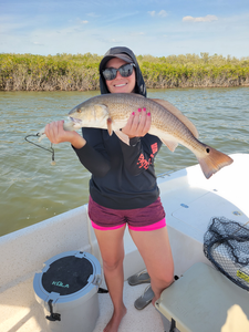 Reeling in the redfish with finesse in Homosassa's clear waters!