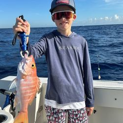 A lone angler fishing in the sunny waters of Miami