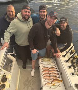 Five anglers enjoying a fishing tour in FL
