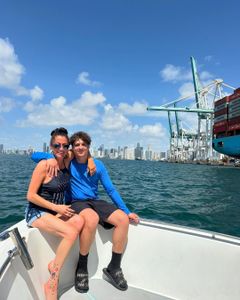 Two people fishing on the water in FL