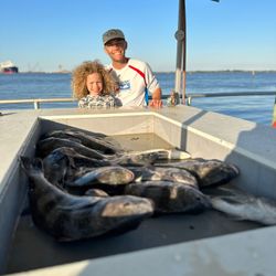 Two anglers fishing in TX with a 27-inch catch